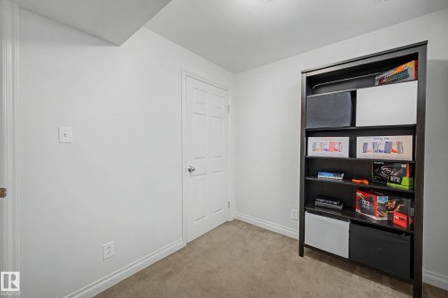 Room featuring neutral-toned carpet flooring and white painted walls - 16211 55A Street, Edmonton, AB - Indoor Photo Showing Other Room