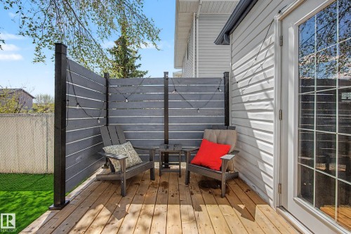 Wood-finish deck with privacy screening and attached string lighting - 16211 55A Street, Edmonton, AB - Outdoor With Deck Patio Veranda With Exterior