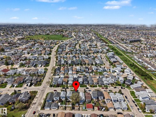 Aerial perspective showcasing a residential neighborhood with single-family homes and mature landscaping - 16211 55A Street, Edmonton, AB - Outdoor With View