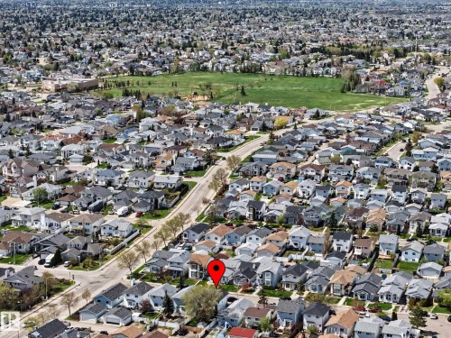 Aerial view showcasing a residential area with a prominent green space - 16211 55A Street, Edmonton, AB - Outdoor With View