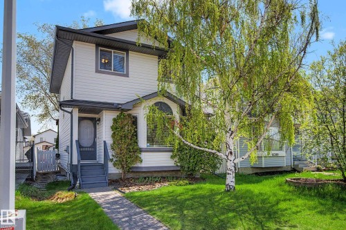 Two-story exterior with white siding and dark trim - 16211 55A Street, Edmonton, AB - Outdoor