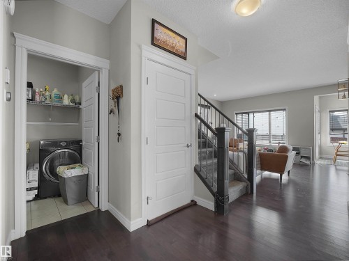 Hardwood-finish flooring throughout the main level - 3247 15 Avenue Nw, Edmonton, AB 