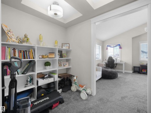 Built-in white shelving with recessed ceiling lighting - 3247 15 Avenue Nw, Edmonton, AB 