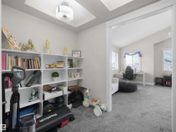 Built-in white shelving with recessed ceiling lighting - 