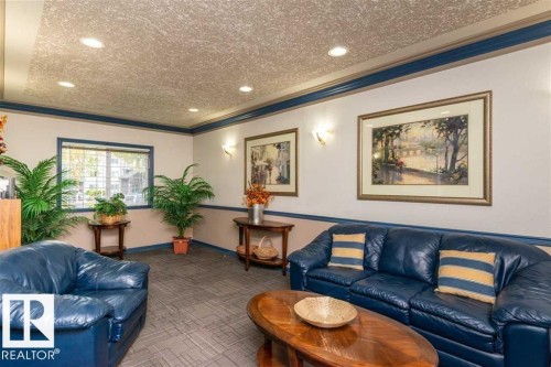 Textured ceiling with recessed lighting - 424 16303 95 Street, Edmonton, AB - Indoor Photo Showing Living Room