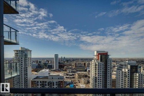 Expansive city skyline featuring multiple high-rise buildings and a clear horizon - 3302 10180 103 Street, Edmonton, AB - Outdoor With Balcony With View