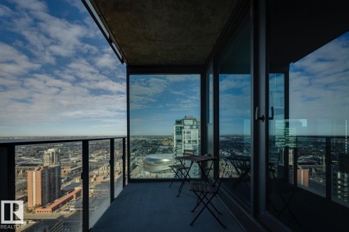Balcony featuring a glass railing system and concrete ceiling - 3302 10180 103 Street, Edmonton, AB - Outdoor With Balcony With View