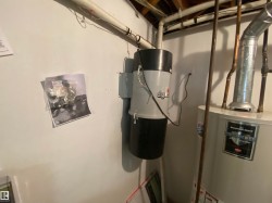 Central vacuum system installation with a Bradford White Defender water heater - 