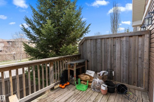 Outdoor wooden deck with a privacy fence - 23 3103 Hilton Drive, Edmonton, AB - Outdoor With Deck Patio Veranda With Exterior