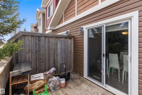 Private deck featuring wood plank flooring and wood privacy fencing - 23 3103 Hilton Drive, Edmonton, AB - Outdoor With Deck Patio Veranda With Exterior