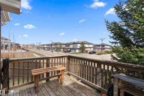 Wood-finish deck with full railing and slatted privacy fencing, providing an elevated outdoor space - 23 3103 Hilton Drive, Edmonton, AB - Outdoor With Deck Patio Veranda