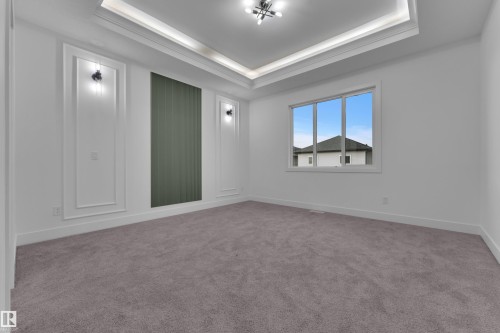 Recessed tray ceiling with integrated lighting - 6226 45 Avenue, Beaumont, AB - Indoor Photo Showing Other Room