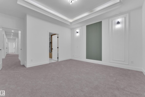 Spacious room with tray ceiling and recessed lighting - 6226 45 Avenue, Beaumont, AB - Indoor Photo Showing Other Room