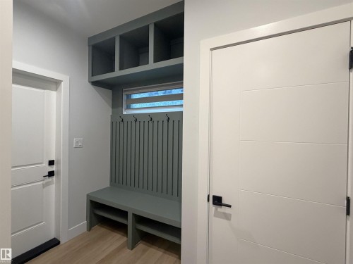 Built-in mudroom bench with cubbies and coat hooks - 162 Edgewater Circle, Leduc, AB - Indoor Photo Showing Other Room