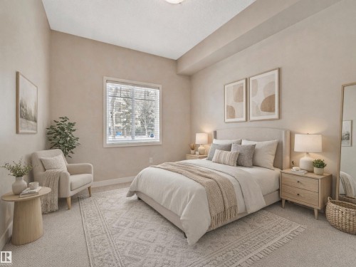 This bedroom features a window with blinds, carpeted flooring, and neutral-toned walls - 120 8931 156 Street, Edmonton, AB - Indoor Photo Showing Bedroom