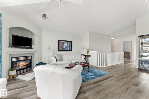 6 10848 8 Avenue, Edmonton, AB - Indoor Photo Showing Living Room With Fireplace