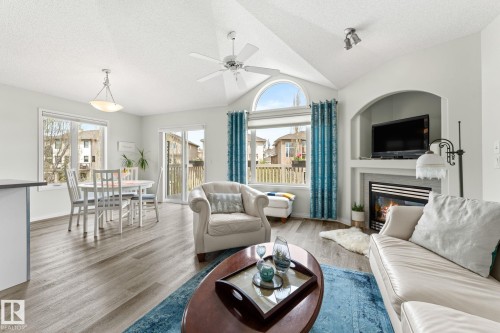 6 10848 8 Avenue, Edmonton, AB - Indoor Photo Showing Living Room With Fireplace