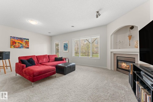 6 10848 8 Avenue, Edmonton, AB - Indoor Photo Showing Living Room With Fireplace