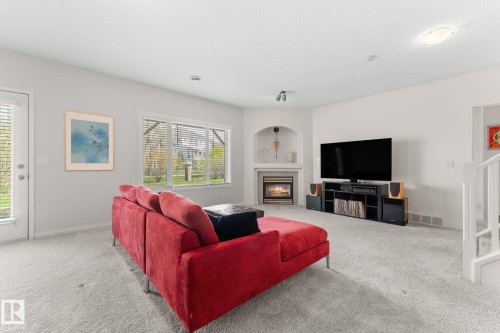 6 10848 8 Avenue, Edmonton, AB - Indoor Photo Showing Living Room With Fireplace