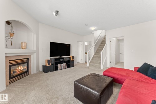 6 10848 8 Avenue, Edmonton, AB - Indoor Photo Showing Living Room With Fireplace
