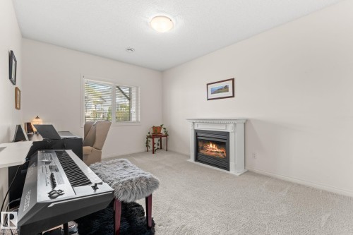 6 10848 8 Avenue, Edmonton, AB - Indoor With Fireplace