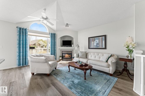 6 10848 8 Avenue, Edmonton, AB - Indoor Photo Showing Living Room With Fireplace