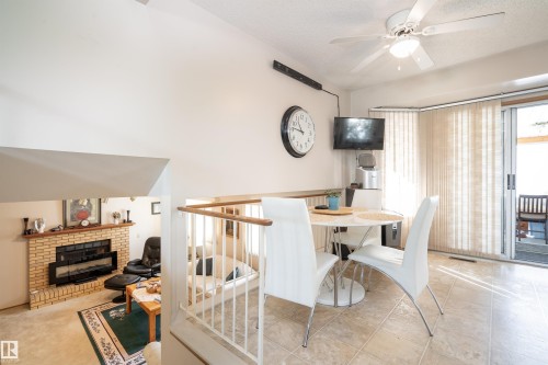 4116 44 Avenue, Stony Plain, AB - Indoor Photo Showing Dining Room With Fireplace