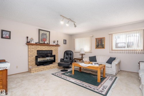 4116 44 Avenue, Stony Plain, AB - Indoor Photo Showing Living Room With Fireplace