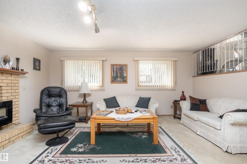 4116 44 Avenue, Stony Plain, AB - Indoor Photo Showing Living Room With Fireplace