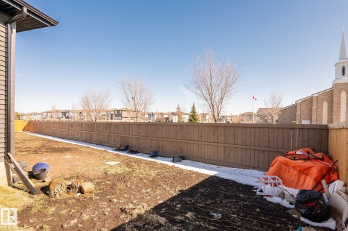 Spacious backyard with a wood privacy fence outlining the perimeter - 6607 50A Avenue, Beaumont, AB - Outdoor