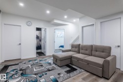 Wood-finish flooring throughout, complemented by recessed ceiling lighting - 