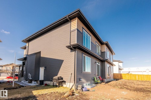 Contemporary exterior with dark horizontal siding and light horizontal siding accents - 6607 50A Avenue, Beaumont, AB - Outdoor