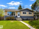 Split-level residence featuring a stucco and siding exterior, a front entry with a white door, and a concrete walkway - 5125 46 Ave, St. Paul Town, AB  - Outdoor With Facade 