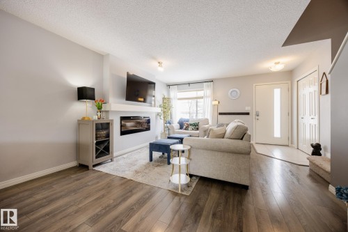 3841 Powell Wynd Sw, Edmonton, AB - Indoor Photo Showing Living Room With Fireplace