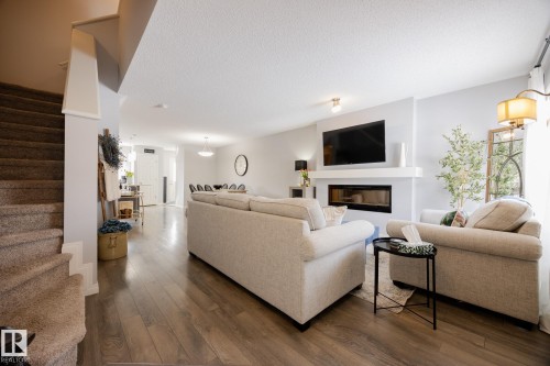 3841 Powell Wynd Sw, Edmonton, AB - Indoor Photo Showing Living Room With Fireplace
