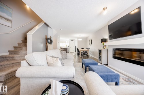 3841 Powell Wynd Sw, Edmonton, AB - Indoor Photo Showing Living Room With Fireplace
