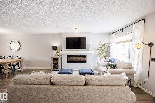 3841 Powell Wynd Sw, Edmonton, AB - Indoor Photo Showing Living Room With Fireplace