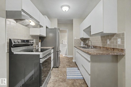 20D Callingwood Crest, Edmonton, AB - Indoor Photo Showing Kitchen With Double Sink