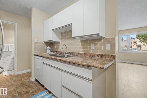 20D Callingwood Crest, Edmonton, AB - Indoor Photo Showing Kitchen With Double Sink