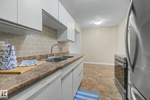 20D Callingwood Crest, Edmonton, AB - Indoor Photo Showing Kitchen With Double Sink