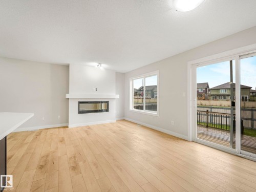 7327 24 Avenue, Edmonton, AB - Indoor Photo Showing Living Room With Fireplace