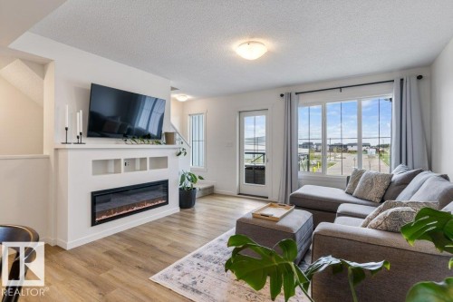 4 Jensen Gate, St. Albert, AB - Indoor Photo Showing Living Room With Fireplace