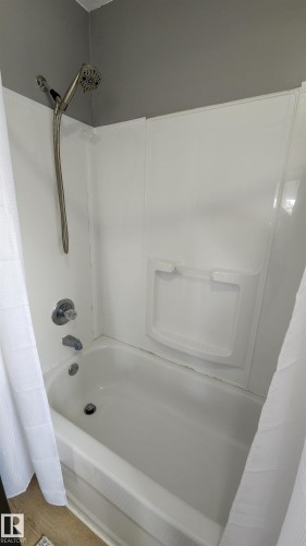 Soaker tub with shower - 5017 51 Street, Elk Point, AB - Indoor Photo Showing Bathroom