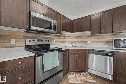 1401 9363 Simpson Drive, Edmonton, AB - Indoor Photo Showing Kitchen With Double Sink