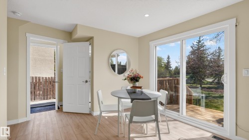 Dining area featuring wood-finish flooring, recessed lighting, and neutral wall tones - 14125 30 Street, Edmonton, AB - Indoor