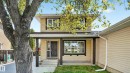 Two-story residence featuring light yellow siding with dark trim accents - 14125 30 Street, Edmonton, AB  - Outdoor 
