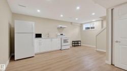 Open concept living space featuring wood-finish flooring, recessed lighting, and a neutral color palette - 