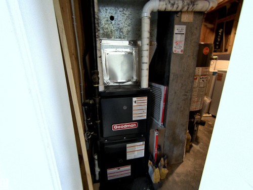 Goodman furnace unit with visible ductwork and piping - 14125 30 Street, Edmonton, AB - Indoor Photo Showing Basement
