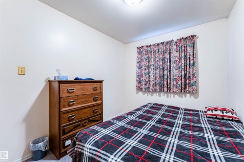 Neutral colored walls and carpeted flooring define this room - 13231 74 Street, Edmonton, AB - Indoor Photo Showing Bedroom