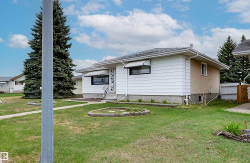 Single-story residence featuring white horizontal siding and stucco accents - 13231 74 Street, Edmonton, AB - Outdoor